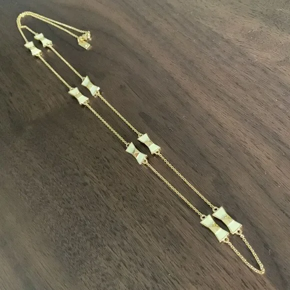 KATE Spade enamel/gold bow gold tone chain necklace